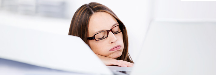 Chiropractic Louisville KY Woman Falling Asleep at Desk