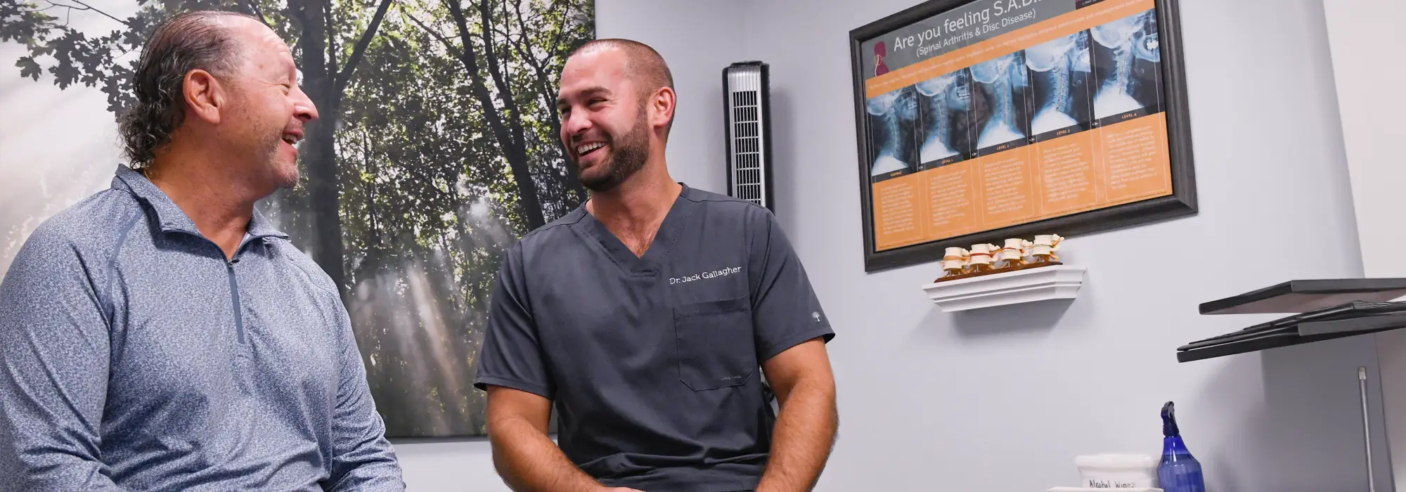 Chiropractor Louisville KY Jack Gallagher with Patient